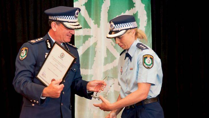 Detective Inspector Denby Lea Eardley collects an award from Commissioner Andrew Scipione in 2012.  Photo: Supplied