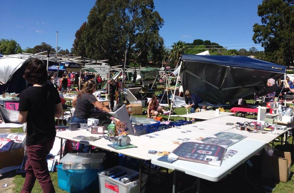 FROM NOWHERE: The scene at the monthly market at Corrigans Reserve on Sunday after a wind described as a "mini cyclone" ripped through.