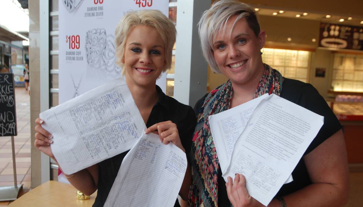 MUSIC FANS: Batehaven’s Rebecca Douglas (right) and friend Cori-Lei Deacon with petitions to return Saturday night live music to the Bayview Hotel beer garden.