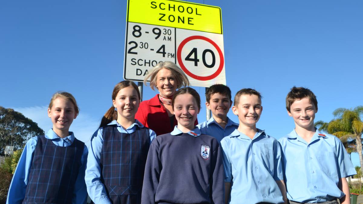 LIGHT UP:  St Bernard’s Primary School student representative council Teagan Moses, Holli Cockram, Sarah Smith (captain), Jordan Bandur, Riley Dell and Nicholas Usher with principal Jacqueline Heffernan. The school will be one of four in Moruya and Batemans Bay to be getting school zone lights.