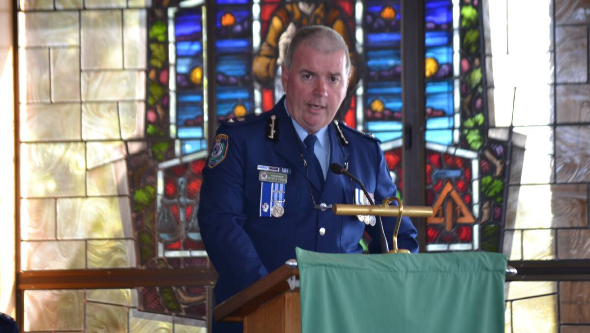REMEMBERING friends Far South Coast LAC Superintendent Peter O'Brien at the National Police Remembrance Day service at St Bernard's Church in Batehaven on Monday.