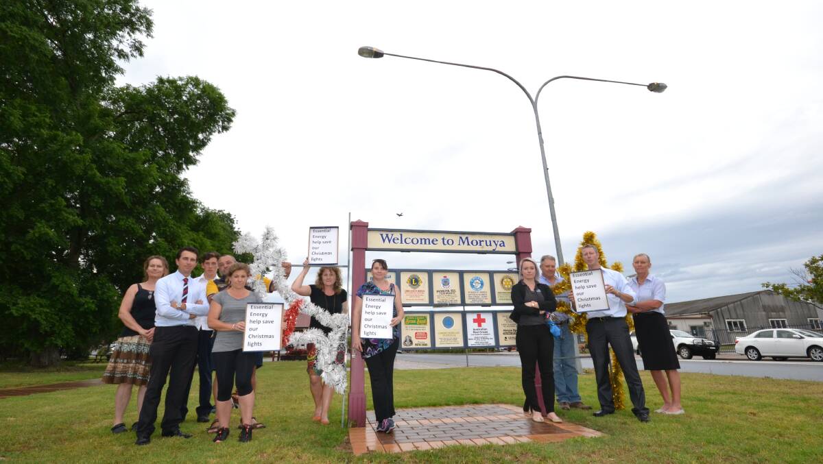 SHORT FUSED: Moruya business owners came together at Apex Park on Monday to protest new Essential Energy requirements which prevent community members putting up Christmas decorations on power poles.
