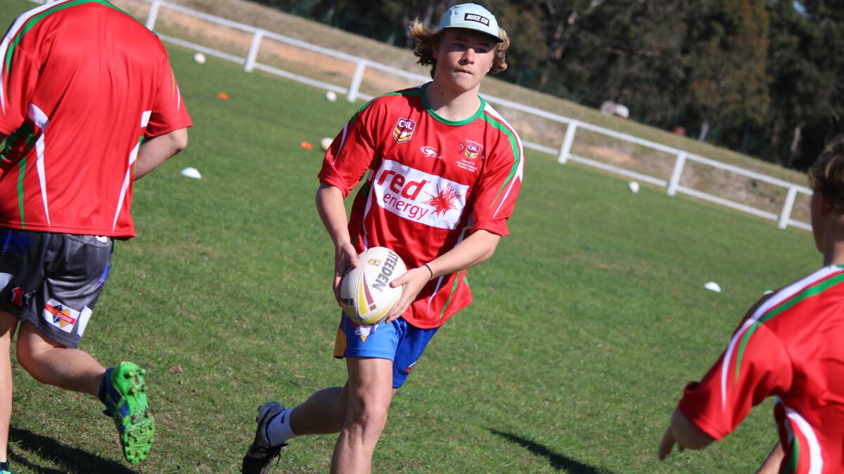 GROUP TALENT: Bega Rooster James Grant makes a pass in the skills session at the first Group 16 clinic held on Sunday.