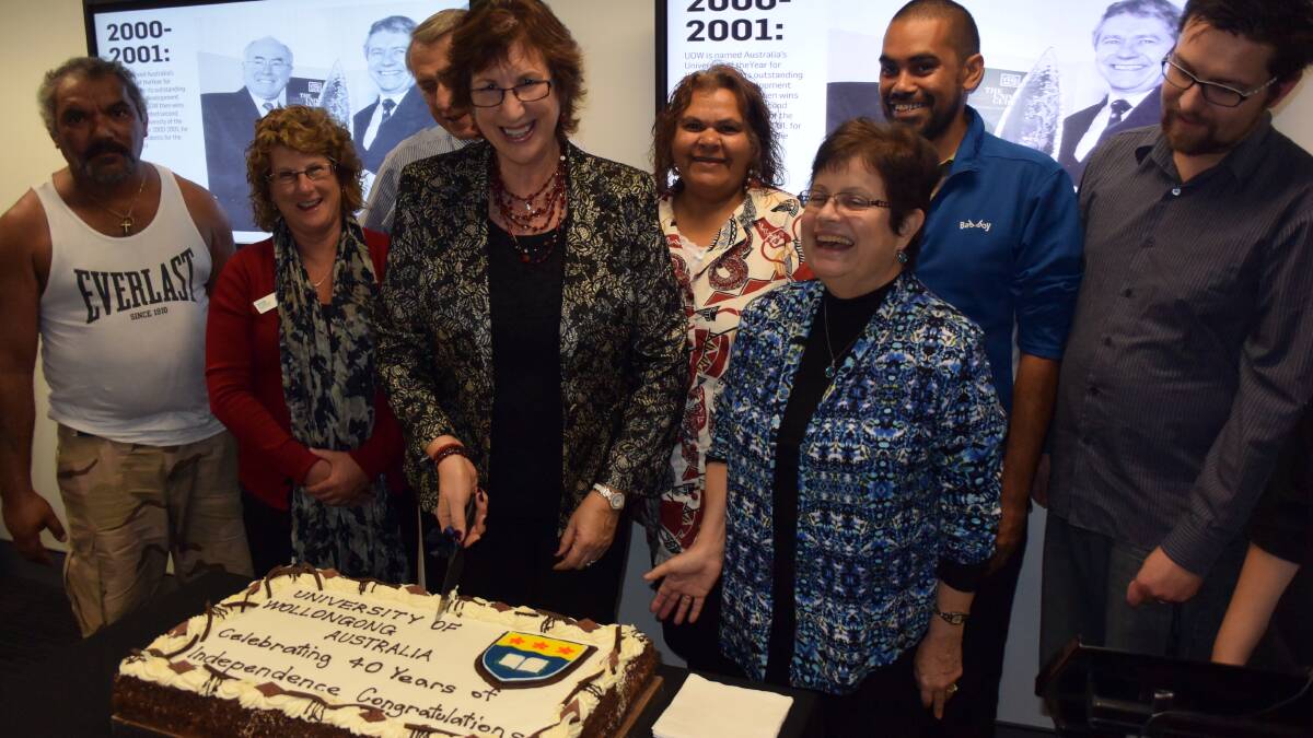 BIG DAY: Michael Davis, Sharon McIntosh, Peter McLean, Anne Snowball, Gayl Vidgen, Loretta Parsley, Henry Stewart and Adam Gowen celebrate the 40th anniversary of the University of Wollongong and 15 years of successful operation of the Batemans Bay campus. 