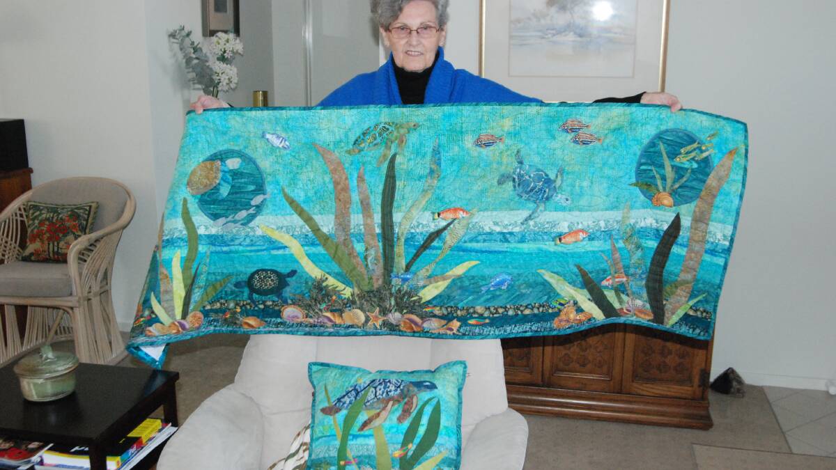 QUALITY QUILTING: Broulee’s Oriel Smith with a fine example of her patchwork quilting, a work featuring marine life.