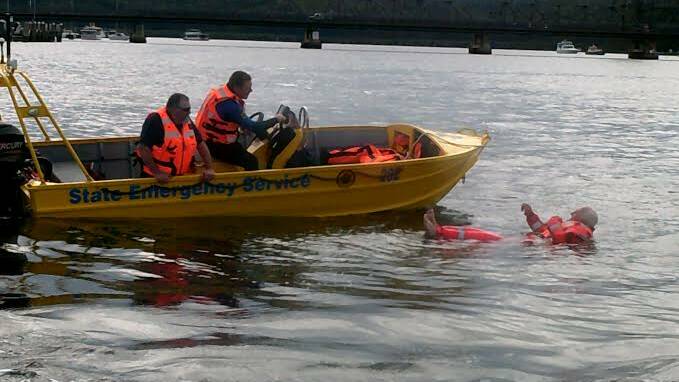 FLOOD READY: Ken Jarrett, Daniel McDermott and Robert McLachlan during a water rescue exercise at Batemans Bay.
