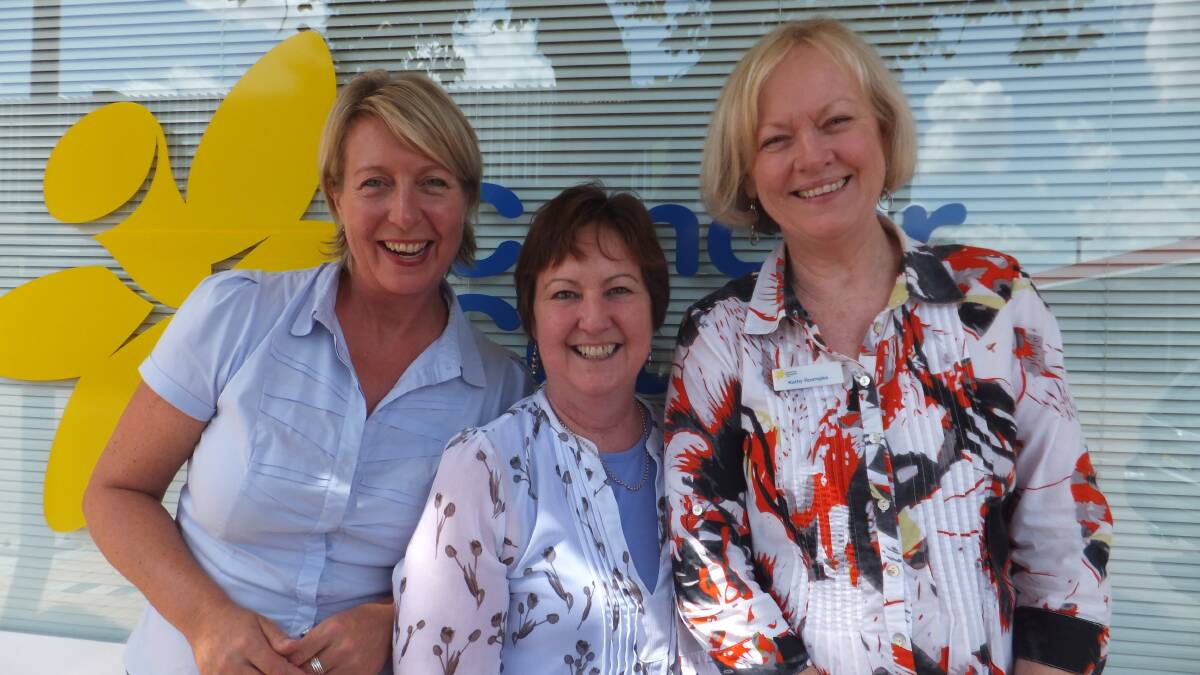 IMPORTANT MESSAGE: Cancer Council staff Mandy Judd (left) and Kath Roempke (right) with cancer survivor Carol Rhodes (centre) at a Living Well After Cancer program.