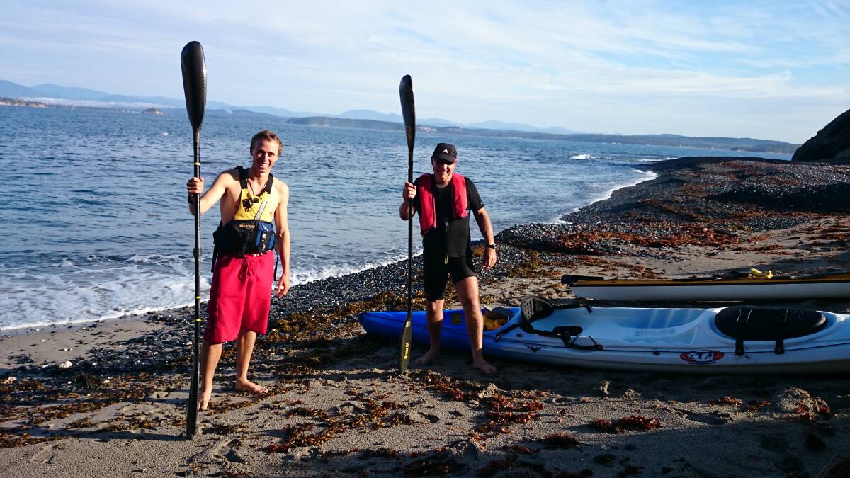 BOARDS FOR KAYAKS: Westpac rescue helicopter crewman Wade Coster and trainer Ken Bellette.