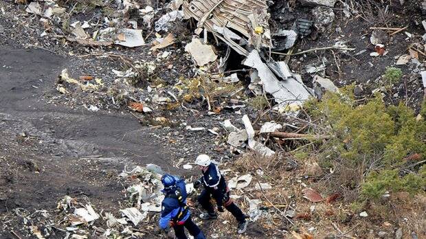 French investigators sift through wreckage at the crash site. Photo: Reuters