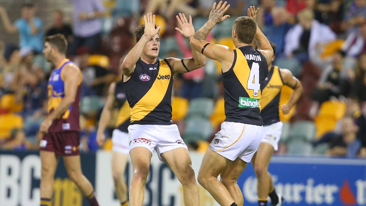Nathan Gordon of the Tigers celebrates kicking a goal during the round five AFL match between the Brisbane Lions and the Richmond Tigers at The Gabba on April 17, 2014 in Brisbane, Australia. Photo: Chris Hyde/Getty Images.