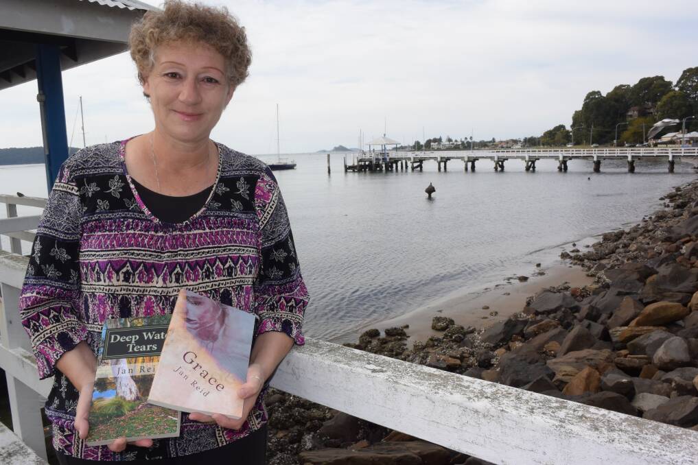 BOOK LOVER: Catalina author and avid reader Jan Reid with her debut novel Deep Water Tears, and its sequel, Grace.
 
