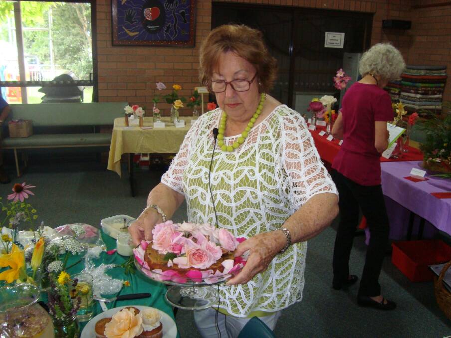 LOVE THIS: Batemans Bay Garden Club member Sandra Martin stirred up appetites with her talk about edible plants at the February meeting, especially with her magnificent Persian love cake decorated with roses.
 