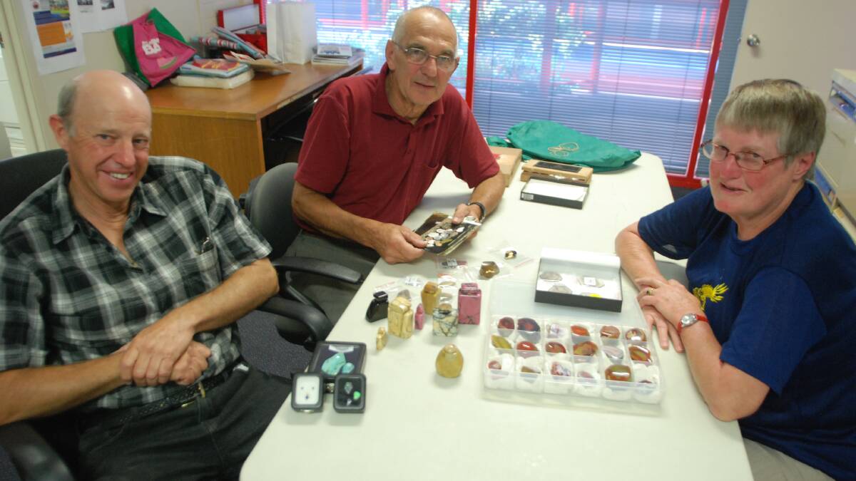 ROCK SHOW: Batemans Bay Lapidary Club’s John Butcher and Bernie and Jennie Hapgood with examples from their collections.  