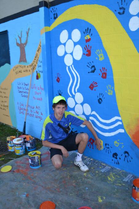 SERPENT TIME: Teen Michael McFarlane says he thrived on the chance to bring a rainbow serpent to life in a Batemans Bay laneway 