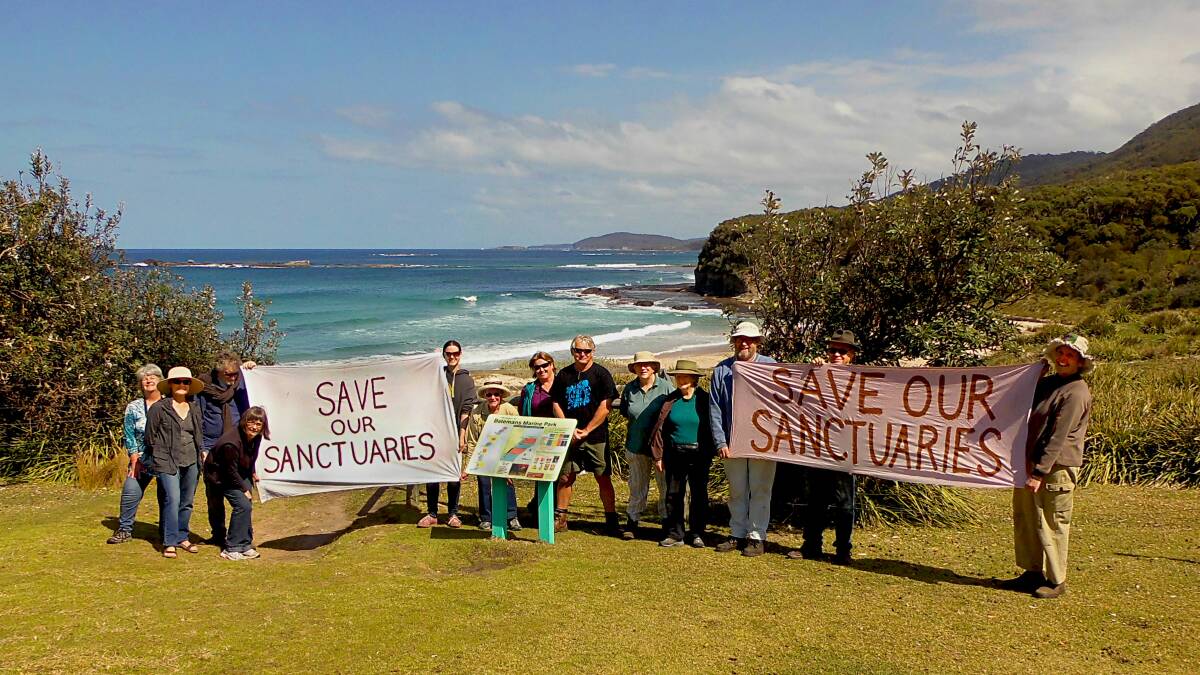 FISH FRIENDS: Wendy Fuller, Yvonne Jenkins, Neil Brown, Paola Harvey, Maggie Mance, Judith Carroll, John Perkins, Kirsten Vine, Marg Hamon, Cecilia Bradley, Don Davidson, Roger Jenkins and Sybille Davidson at the Save our Sanctuaries rally at Pretty Beach on Saturday. 