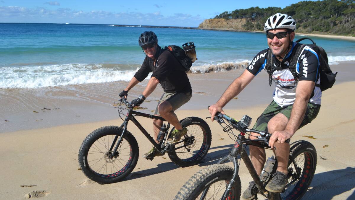 Westpac Life Saver Helicopter Pilot Matt O'Brien and Air Crewman Keith McReynolds take to the sand on bikes. 