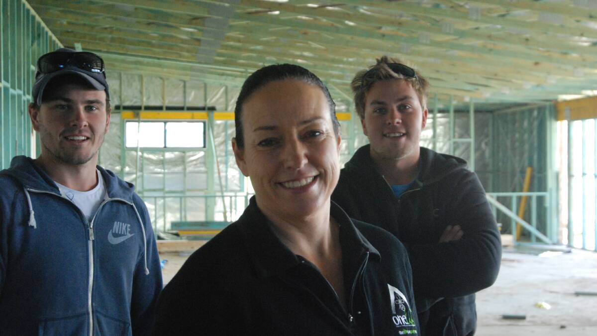 LEVY NEEDED: Batemans Bay Surf Life Saving Club’s Tracy Innes, Andy Pustavrh (left) and Anthony Bellette in the partially completed Malua Bay building. Ms Innes says the club can complete renovations to lock-up, but needs $150,000 for a commercial kitchen, bar and function room. 
