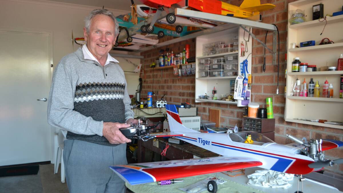 FLY BOY: Broulee’s Ken Carey with some of his flying model aircraft.