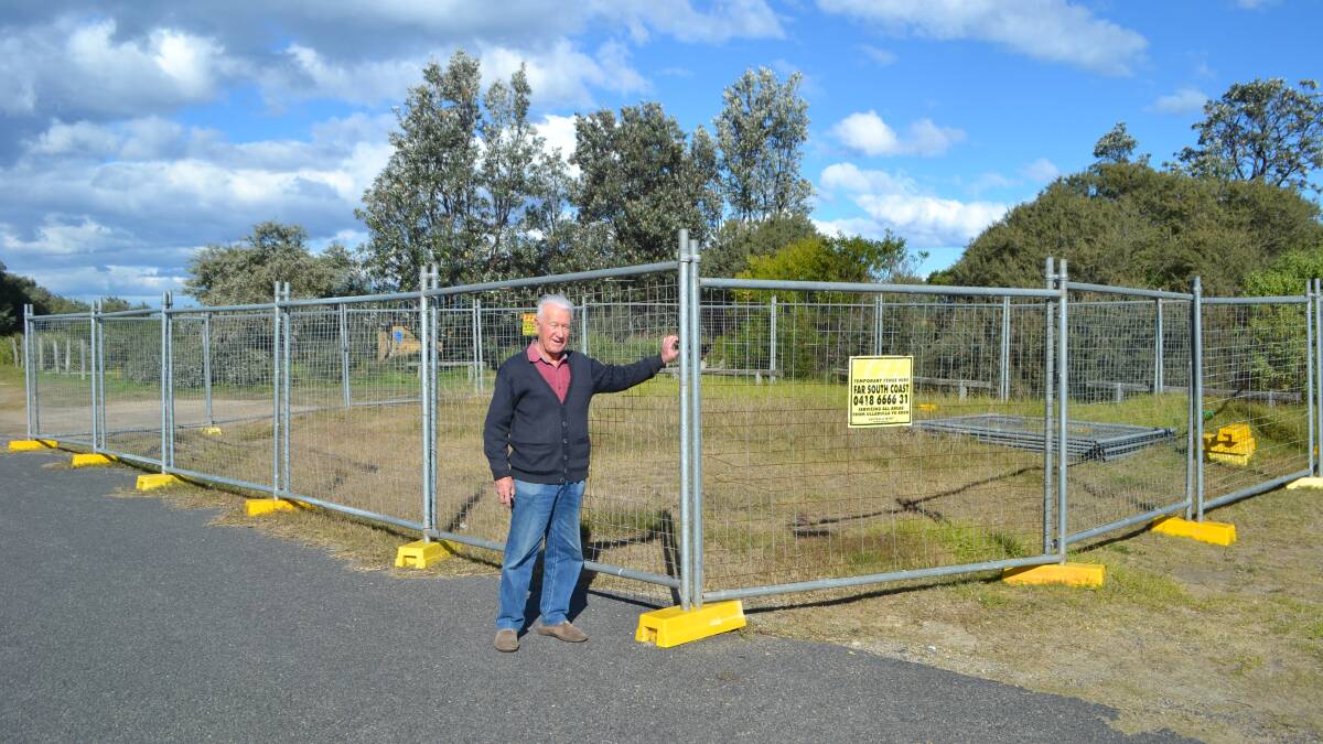 CONCERNED: Tomakin resident Bill McKenzie wants answers about what is happening with the fenced off site at the Tomakin Boat Ramp 