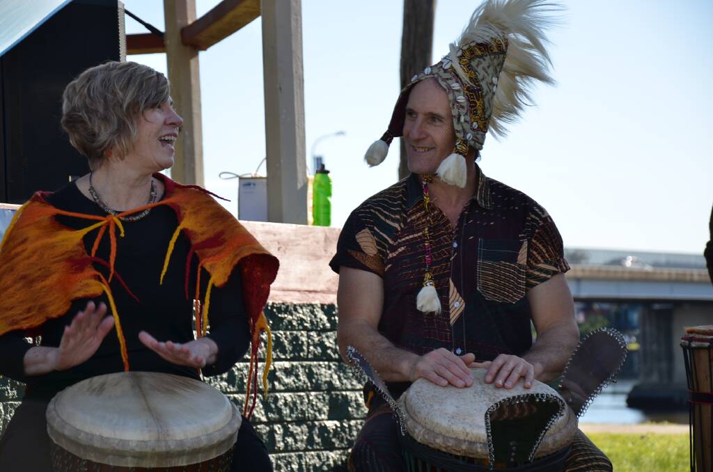 DRUM FUN: Cathy Simpson and Rob Merigan enjoy a percussive moment at the River of Diversity Festival in Moruya on Saturday. 