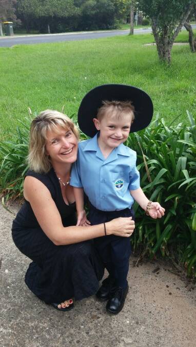 OFF TO SCHOOL:  Mossy Point’s Rowena Blewitt sends her son Harper, 5, off to his first day of school at St Peters Anglican College on Wednesday.
