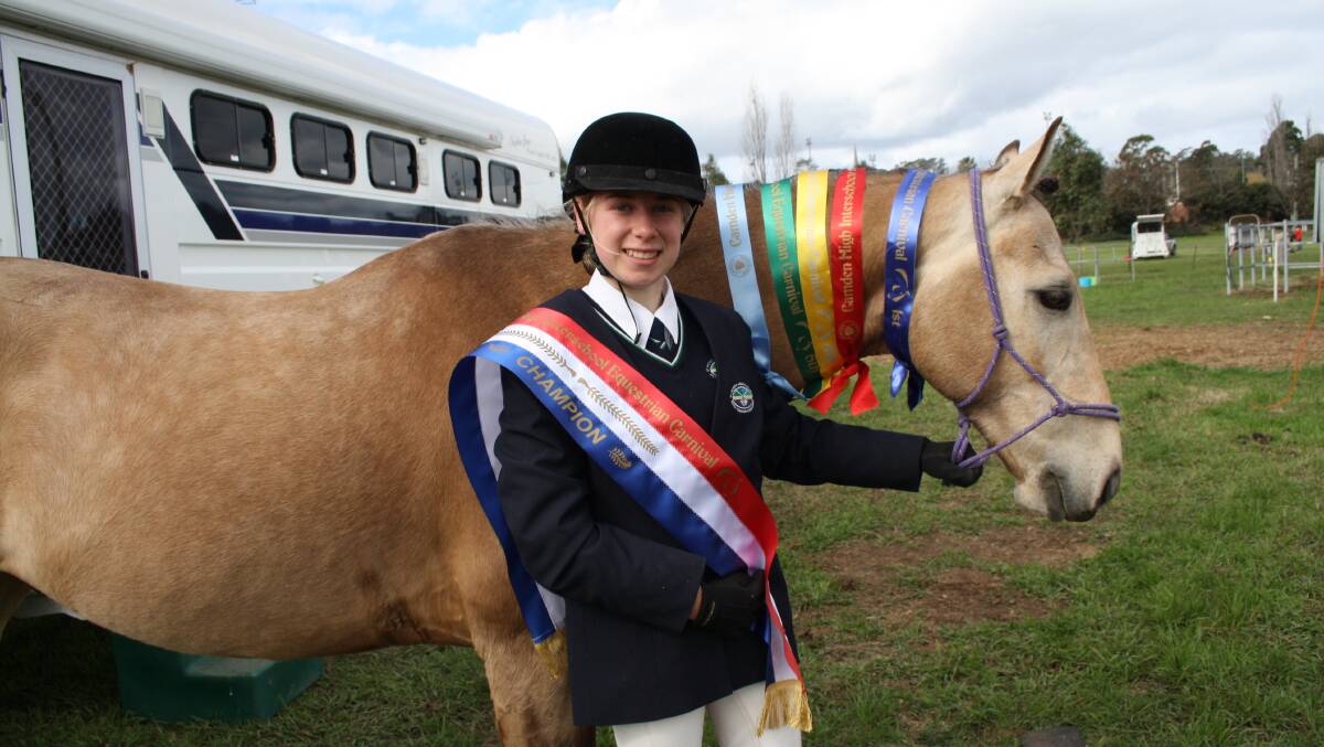 TOP RIDER: Isabella Wall and Phoenix with the rider class ribbons from the Camden Interschool Equestrian Carnival. 
