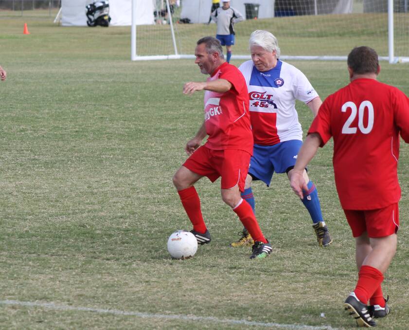 STEP OVER: Eric Danhel pictured playing for the Canberra Old Boys over 50s during the Pan Pacific Masters Games. 