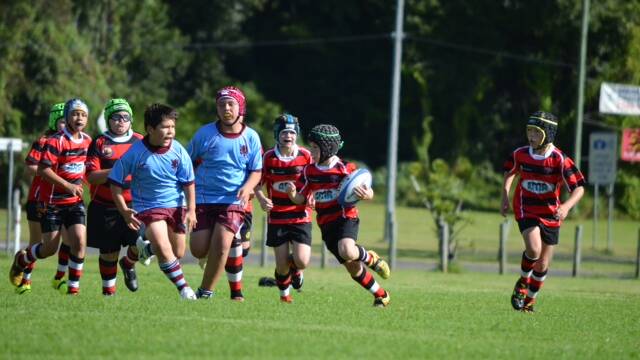 FREE TO ROAM: Batemans Bay Boars under 11s player Lachlan Collier finds space against Wests at Hanging Rock Oval. 

