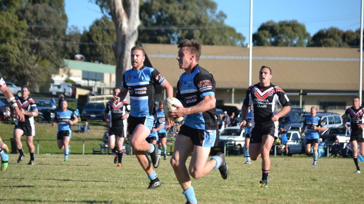 PLAYMAKER: Jake Clarke (with ball) set up a number of tries with long runs against the Cooma Stallions at Ack Weyman Oval on Sunday. 