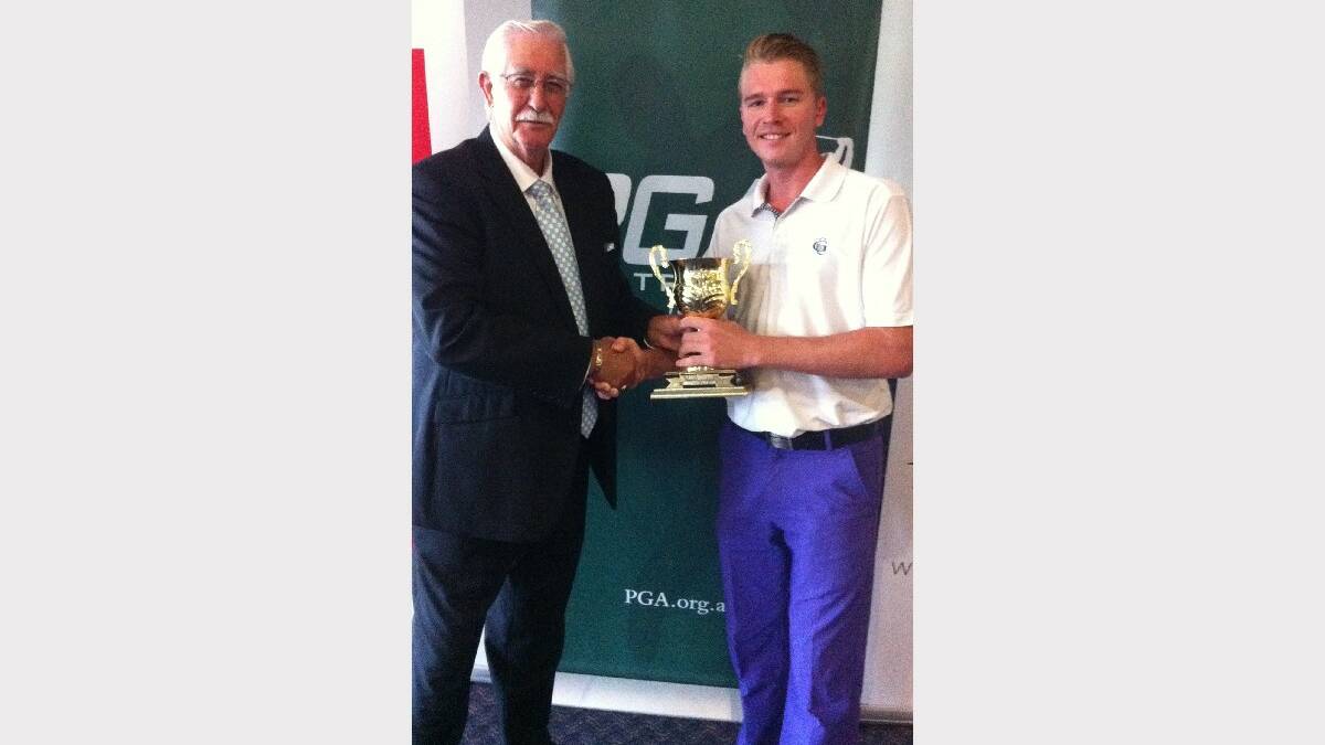 WINNING GRIN: Darcy Nelson of Ainsworth Gaming presents Taylor Cooper with the Moruya Golf Club Trainee Pro-Am trophy. 

