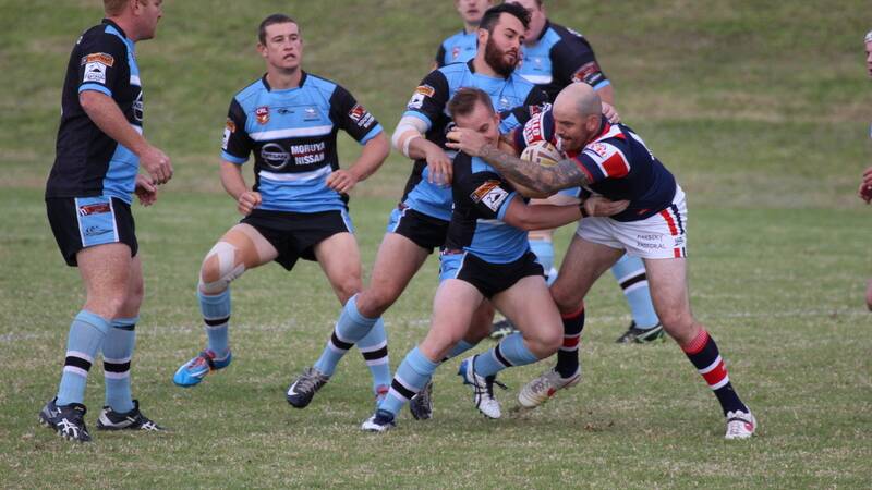 SHARKS CIRCLE: Moruya forwards Shane Colebrook, Dean Scott, Dillon Johnston and Luke Jay look to bring down Bega Roosters’ lock Clay Child. Photo: ANDREW JONES. 