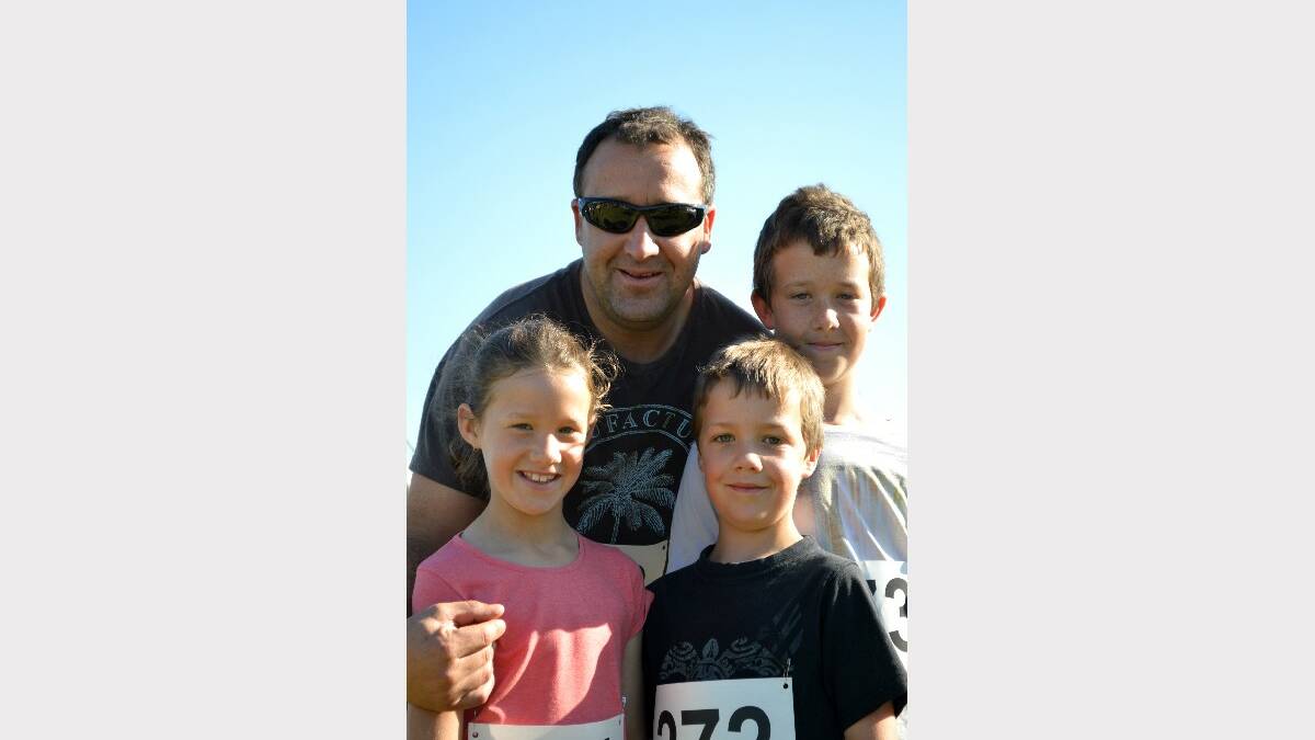 BACK AGAIN: Scott Downey with his children Lily, Adam and Ryan at last year’s event.