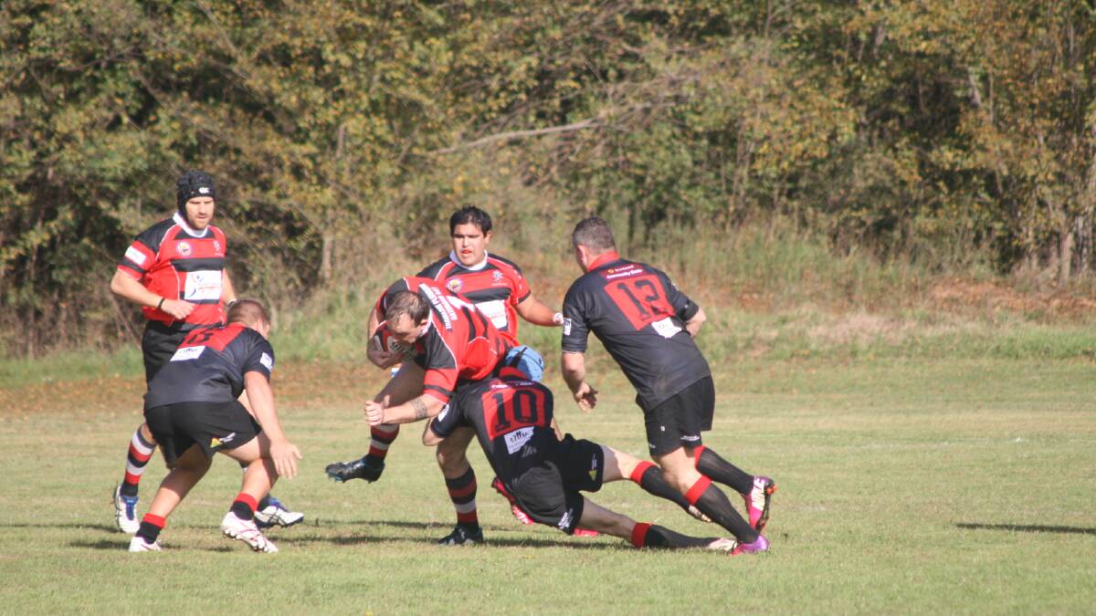 HIT UP: Boars’ prop James Roberts is tackled by Braidwood’s five eighth on Saturday. 