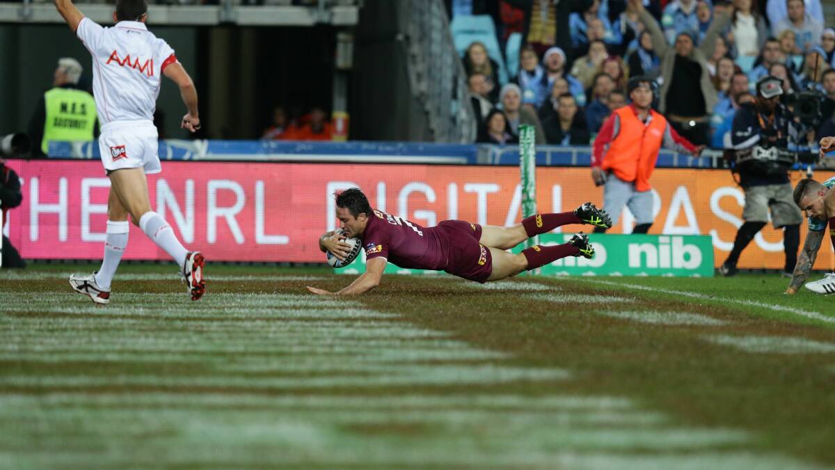BEST HALFBACK AROUND: Cooper Cronk scores the first try in Origin I at ANZ Stadium, Homebush, on Wednesday. Photo: JONATHAN CARROLL.