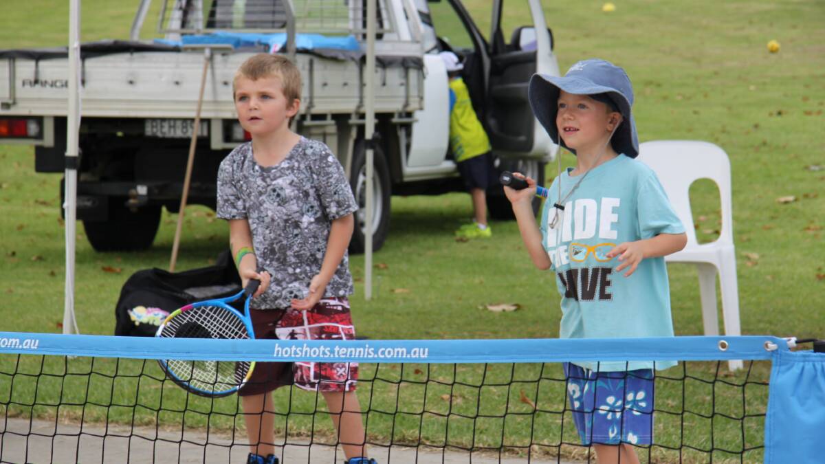 HOLIDAY FUN: Jeshan Davison and Rex Lane test the tennis kit.