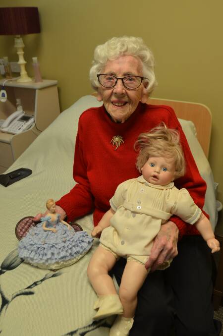 DELIGHTFUL DOLLS: Rona Harvey of Denhams Beach with two of her doll creations. The one on the right depicts her late son, Michael.
