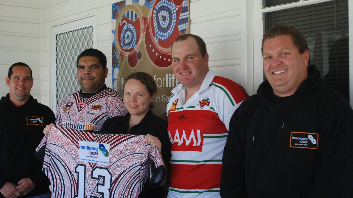 READY TO RUMBLE: Medicare Local employees Shane Chatfield (left), Malindey Sorrell (centre) and Dennis Scott (right) with captains Aaron Brierley and Tim Weyman outside of the Aboriginal Health office in Moruya. 