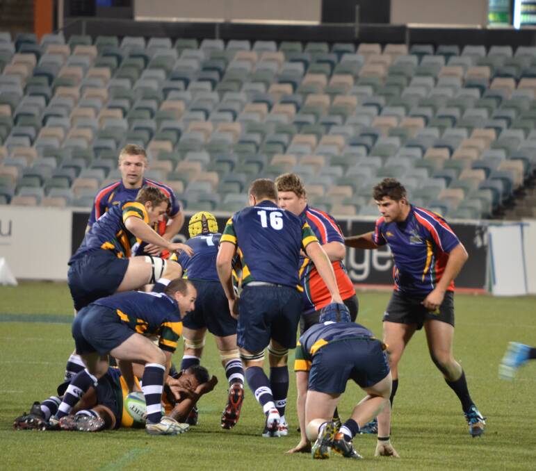 LOCKING IN: Ash Kenny (right) holds his position in the defensive line for the Brumbies’ Provincial representative side. 