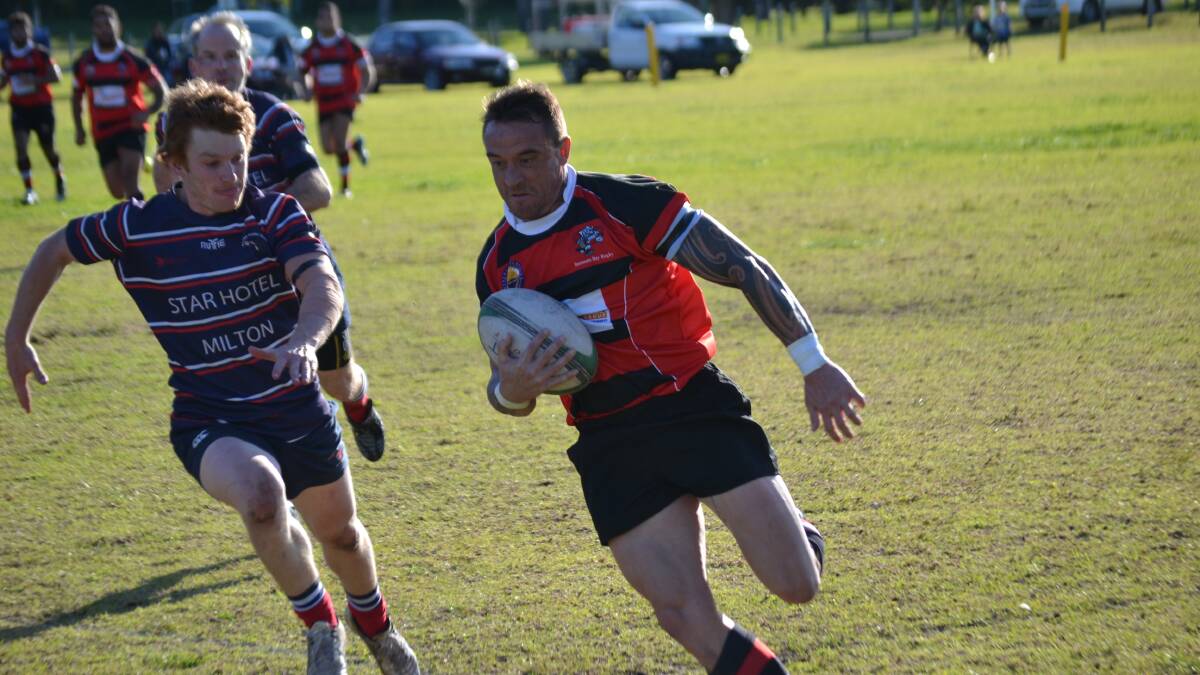 TRY TIME: Boars fullback Cory Maddison sprints past a Platypi defender along the side line at Hanging Rock. 