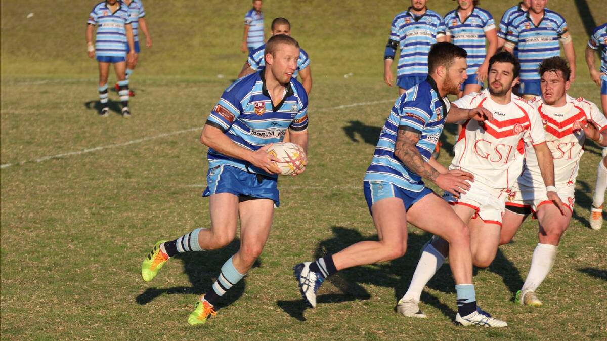 ROOM TO MOVE: Moruya Sharks’ Pat McMahon (with ball) finds room on the fringe of the Eden Tigers’ defence on Sunday. 