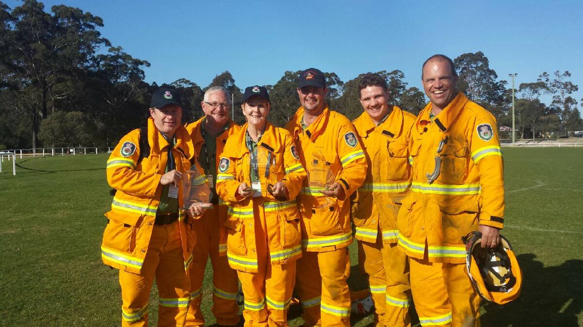 TRIPLE TROPHIES: Surf Beach RFS volunteers Ashley Blackman (captain), Michael Brophy, Jenny Bamman, Craig Wilson, Kevin Shepherd and Dave Decorte with the spoils of the unit’s success at the NSW Rural Fire Service State championships at Pambula. 

