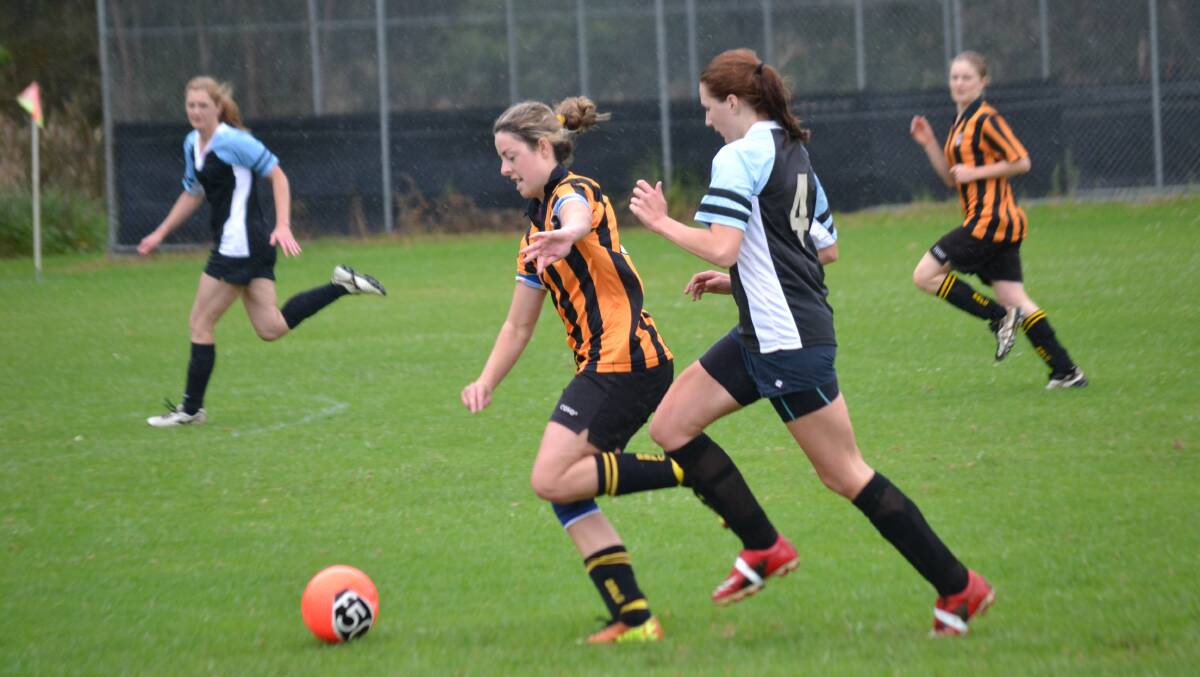 CHASE DOWN: Batemans Bay’s Courtney Vincent dribbles ahead of Moruya’s Ali Baker in a match earlier this season. 