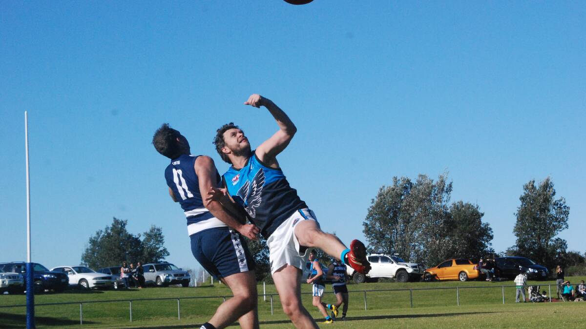 FENDING OFF: Seahawks reserves player Damon Connick pictured playing against Cooma at Hanging Rock. 