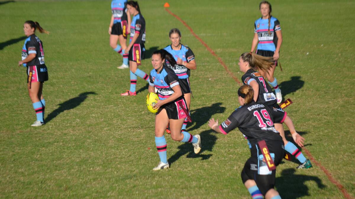 TOP PERFORMANCE: Ellie Doherty (with ball) was the Moruya Sharkettes’ best player against Bombala. 