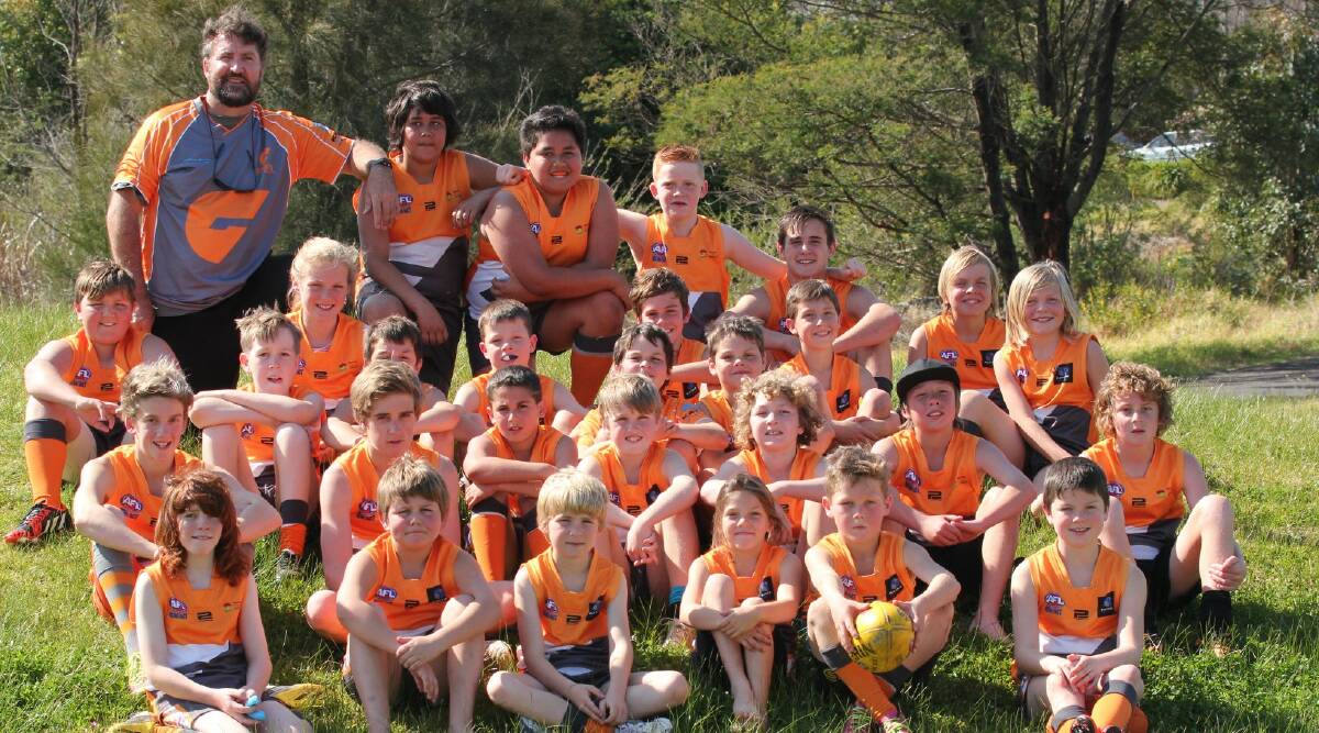 FIRST SEASON: Broulee Moruya Giants coach Nick Stone and the under 13s team. 
