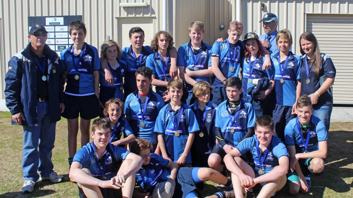 WE ARE THE CHAMPIONS: Broulee Dolphins under 14s coach Alan Morton, assistant Nathan Mass and manager Kylie Filmer with players (back, from left) Luke Campbell, Anthony Patyus, Reece Hancock-Cameron, Angus Crowley, Joe Parkin, Caleb Keller, Rhys Morton and Cody Williams, (middle) Geordie Kemp, Ben Facchini, Kye Walters, Jye Cook and Jordan Macpherson, (front) Shane Mass, Christian Filmer, Ethan Mass and Ryan Foley.

