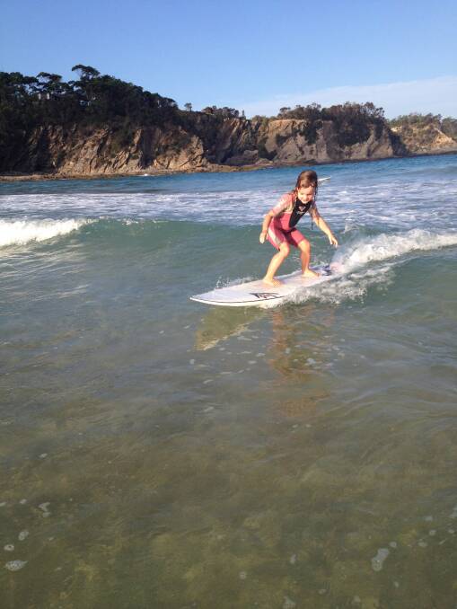 PERFECT TECHNIQUE: Radha Love rides a wave in at McKenzies Beach. 