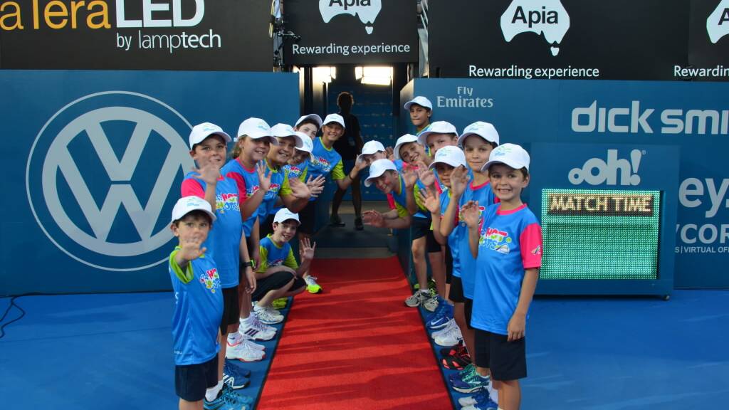 CENTRE COURT: Batemans Bay Tennis Club juniors form a guard of honour before the Apia International women’s final in Sydney. 