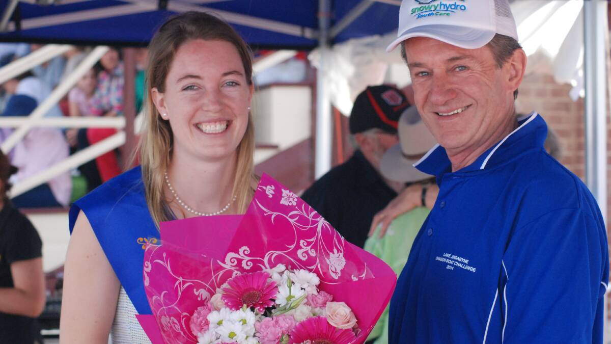 COOMA: Cooma’s Showgirl Millie Mitchell was presented with a bouquet of flowers by Snowy Hydro executive officer Ian Cooke at the opening of the 139th Cooma Show.
