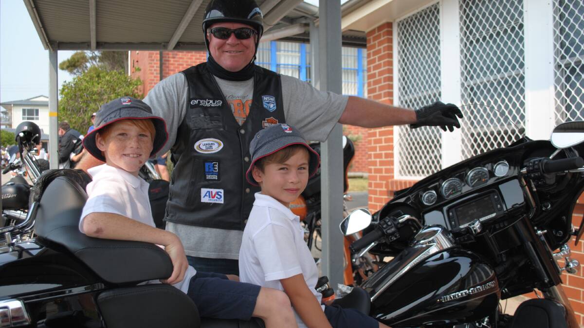 NAROOMA: : Ian Schubert showed off his Harley Davidson to Narooma Public School students Paul Mette and Jarrod Duck when Australian Rugby League legends roared into Narooma Public School for the organisation Hogs for Homeless on Monday.
 